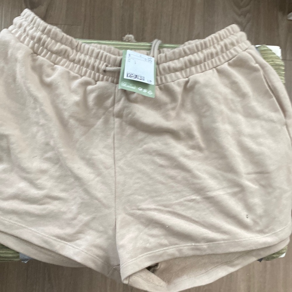 Tan shorts from h&m with tag still on the item
